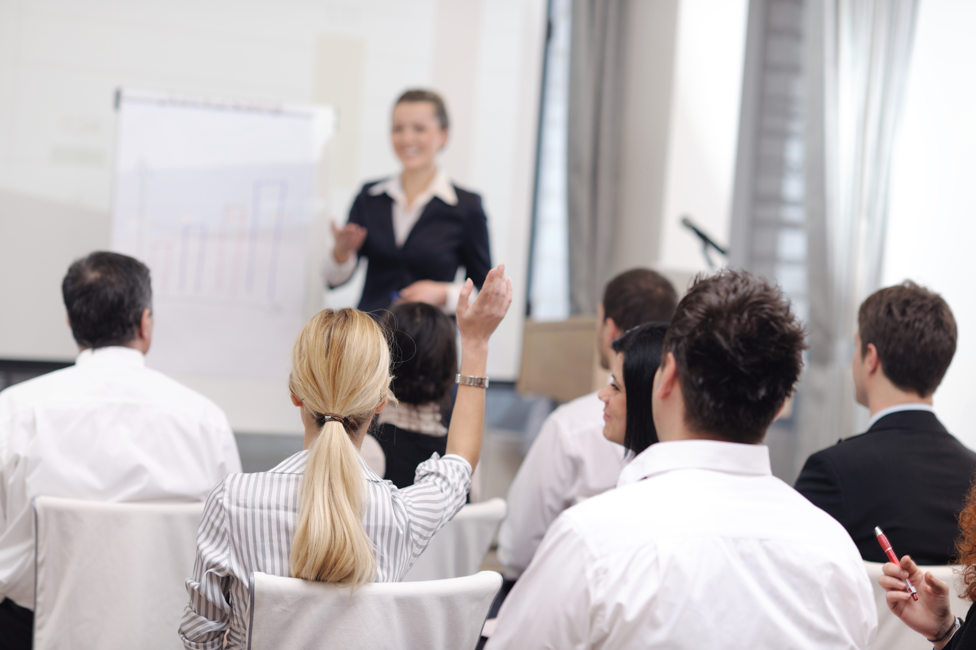 business people group at meeting seminar presentation in brigt conference room